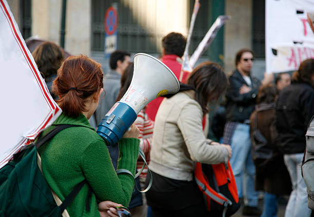 University students waving banners during an educational march in Athens, Greece.